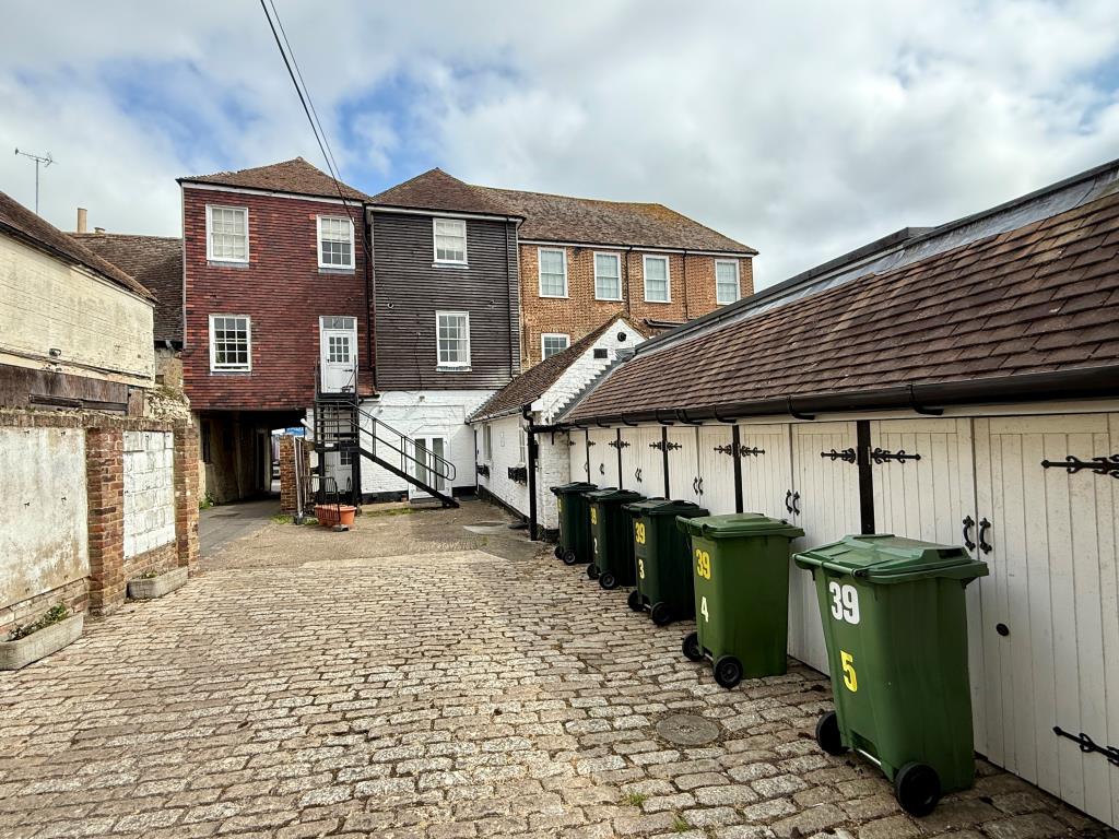 Lot: 72 - MIXED USE INVESTMENT - VACANT SHOP, FIVE FLATS, FIVE PARKING SPACES AND SEVEN STORES - Rear of mixed-use building